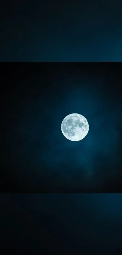 Glowing full moon against a deep blue night sky.