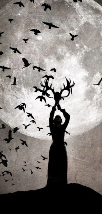 Silhouette holding antlers under full moon with birds flying.