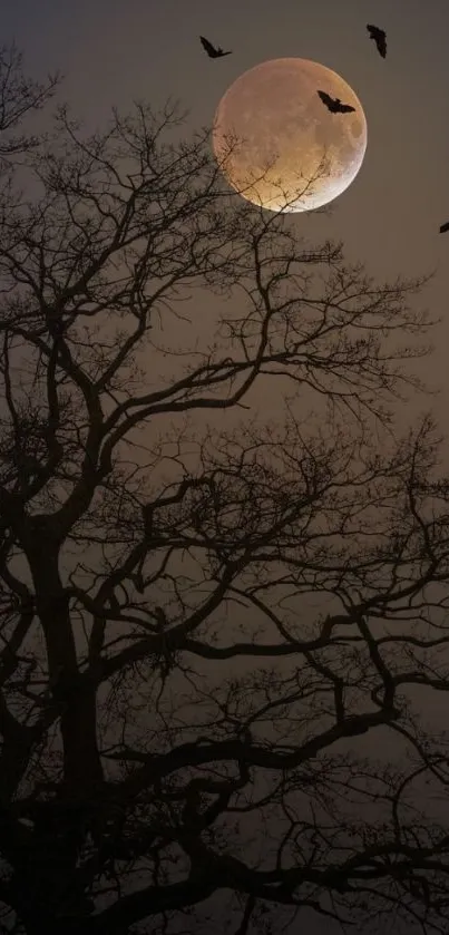 Silhouetted tree against a moonlit night with bats flying.