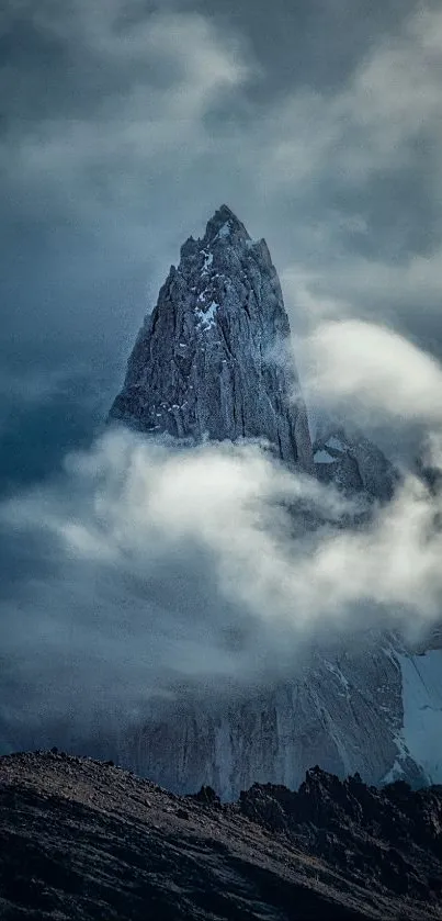 Mystical mountain peak with clouds surrounded by a serene sky.