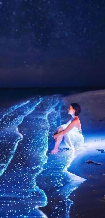 Woman sitting on a glowing beach at night under a starry sky.