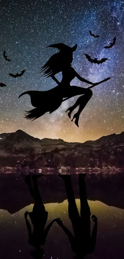 Silhouette of a witch flying with bats in a starry night sky over mountains.