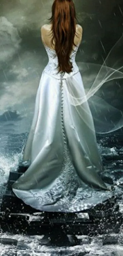 Bride in a flowing dress by the stormy ocean.