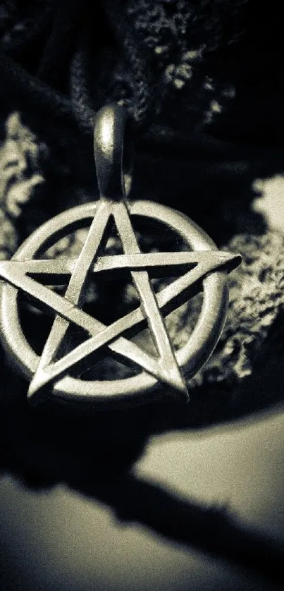 Mystical pentagram featured in dark, artistic mobile wallpaper design.