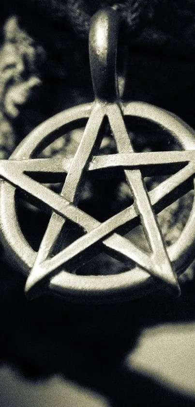 Mystical pentagram pendant on textured background: mobile wallpaper