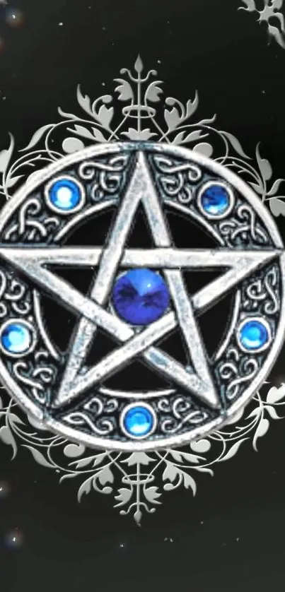 Intricate silver pentagram with blue gems on black background.