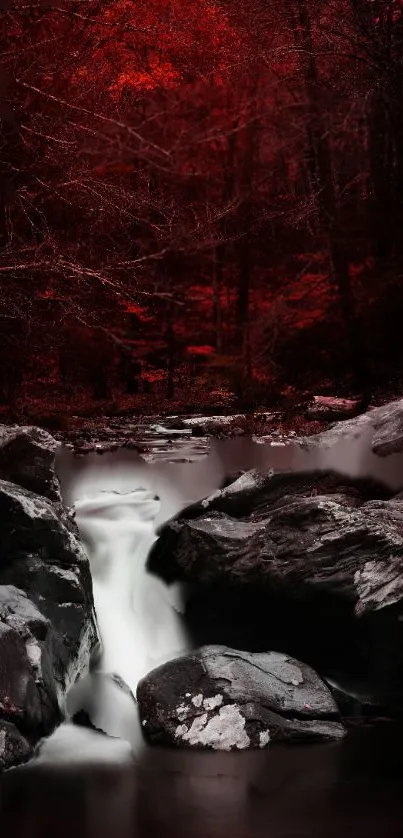 Red forest stream with waterfall cascading over rocks.