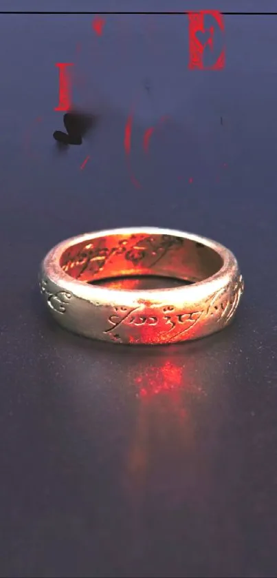 Mystical gold ring with red hues on a dark background.