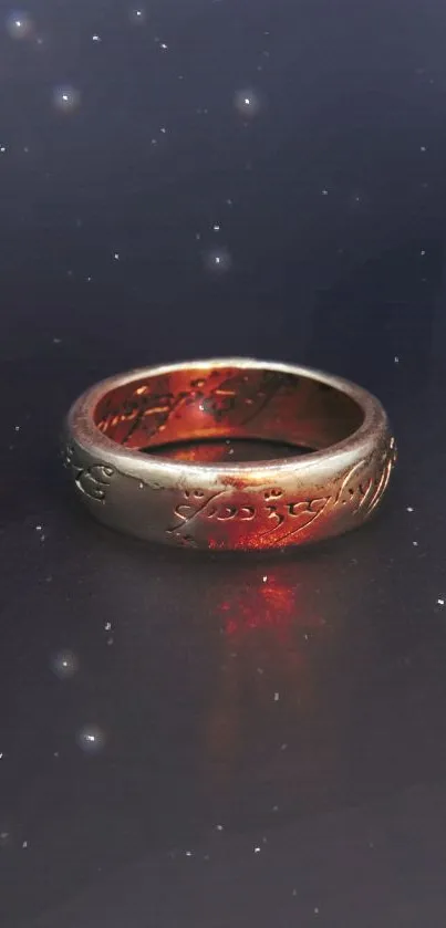 A mystical ring with glowing engravings on a starry dark blue background.