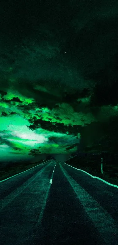 Mysterious road under vibrant green sky in a stunning wallpaper.