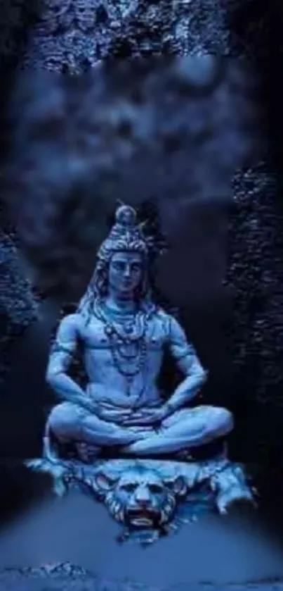 Mystical blue wallpaper with Shiva statue in serene meditation pose.