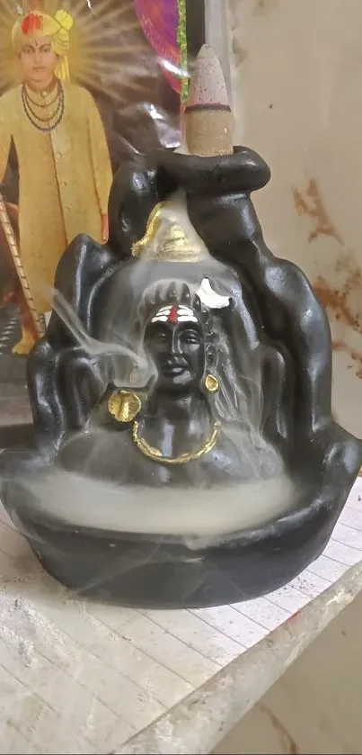 Shiva incense holder with mystical smoke effect and spiritual decor.