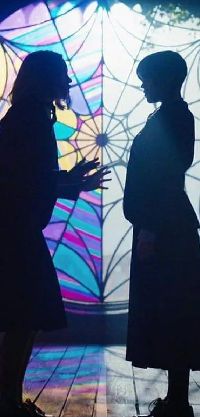 Mystical silhouette of two figures before a stained-glass window.