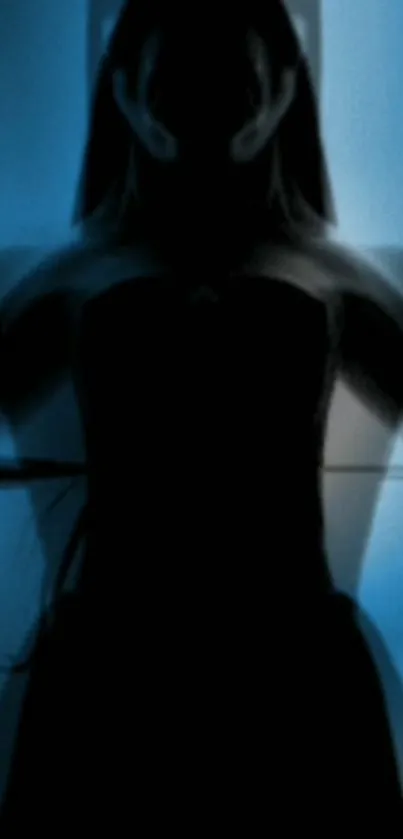 Silhouette of a mysterious figure with a blue background.