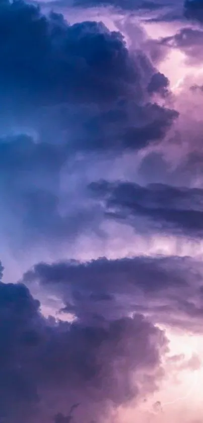 Mystical sky wallpaper with purple and blue clouds.