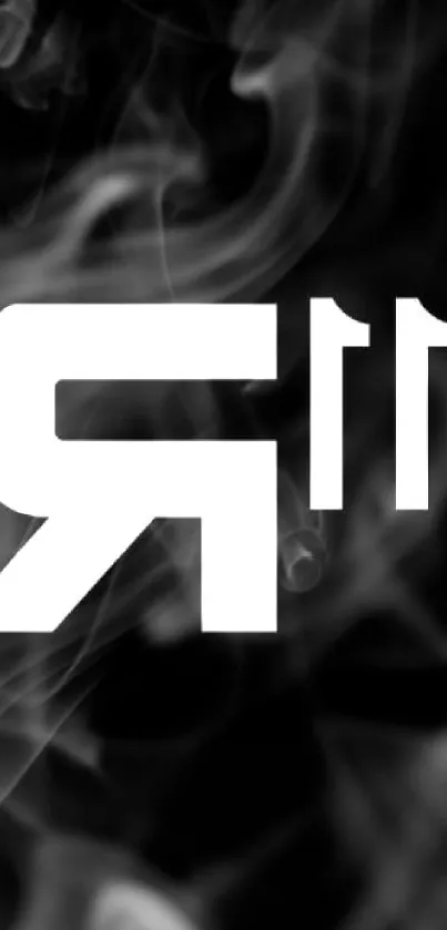 Mystical smoke around a bold white letter R on a dark background wallpaper.