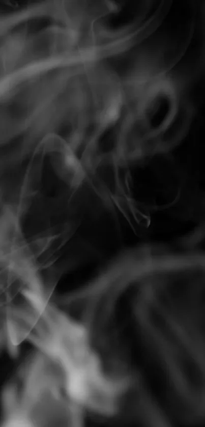 Mystical gray smoke against a black background, abstract wallpaper design.