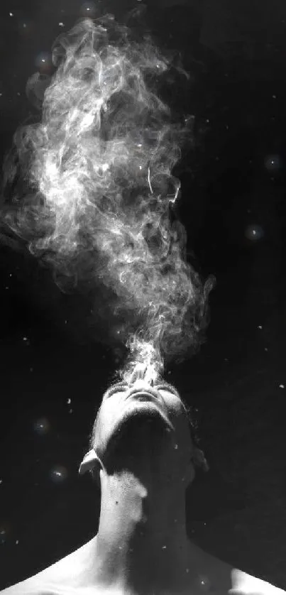 Silhouette with ethereal smoke rising on a black background.