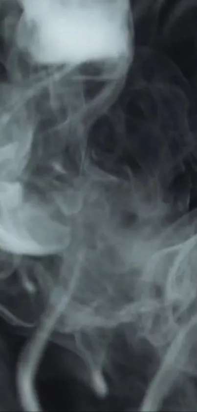 Swirling gray and black smoke on a dark background wallpaper.