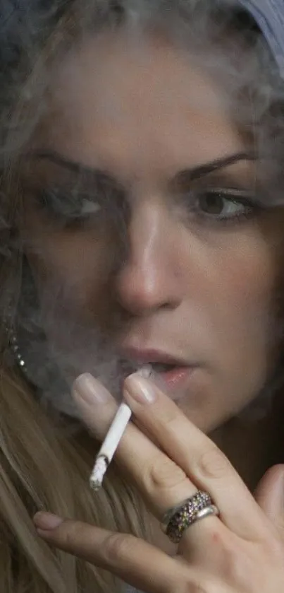 Woman in hood smoking, enveloped in smoke.