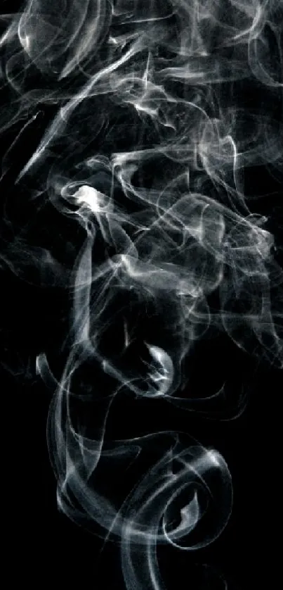 Mystical smoke swirls on a dark black background, creating an abstract design.