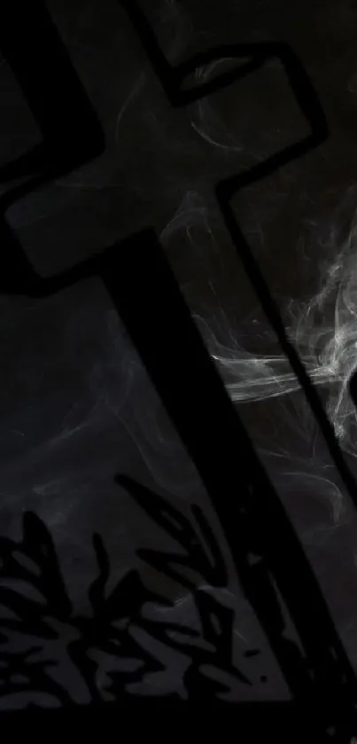 Mystical smoke and cross silhouette on a dark background.