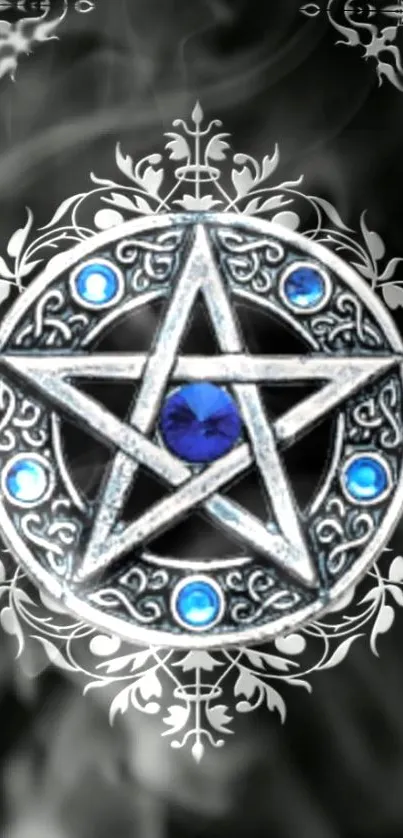 Mystical silver star with blue gems on smoky background.