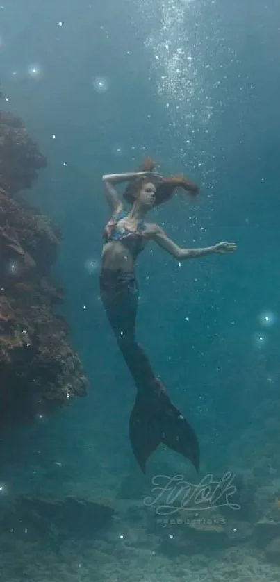 A serene underwater scene with a mystical mermaid swimming gracefully.