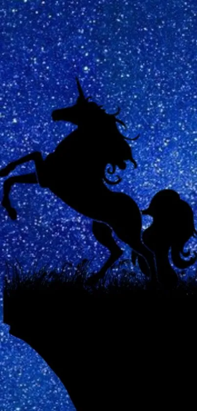 Silhouette of unicorn against a deep blue galaxy starry sky.