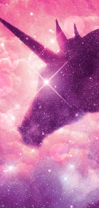 A mystical unicorn silhouette in a vibrant pink galaxy sky with sparkling stars.