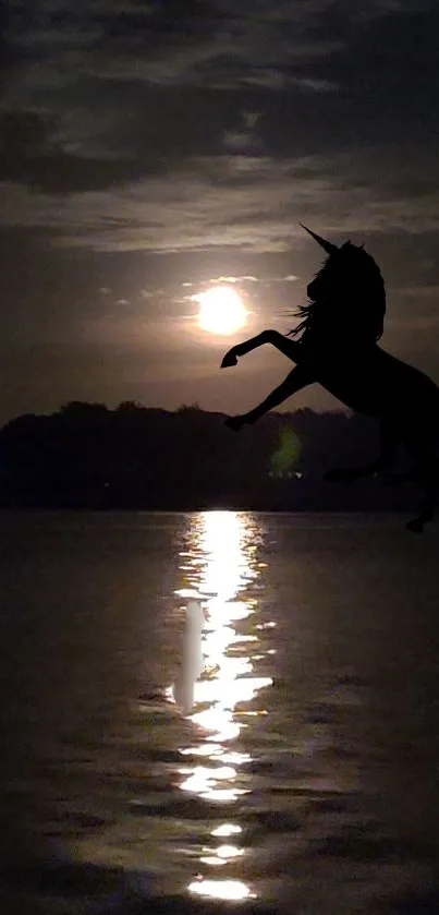 Silhouette of unicorn in moonlit night over water.