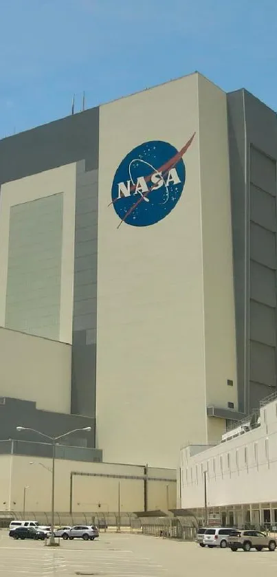 NASA building against a blue sky with a prominent logo and architectural lines.