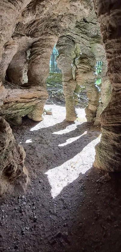 Rustic cave with natural rock formations and sunlight casting shadows.