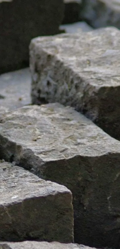 Close-up of natural gray stone texture for mobile wallpaper.