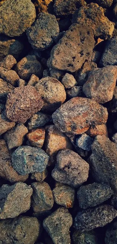 Close-up of assorted natural rocks with earthy textures as a wallpaper background.