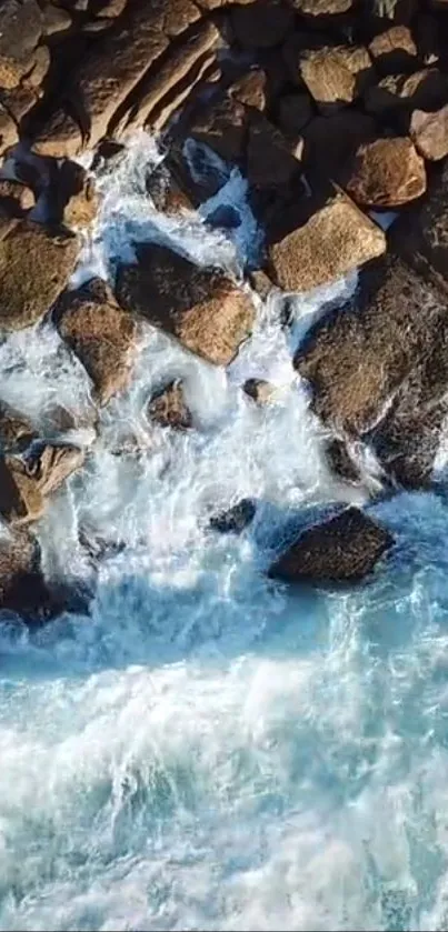 Waves crash against rocky shoreline, nature wallpaper.