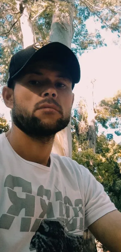 Man in a cap with a nature background.