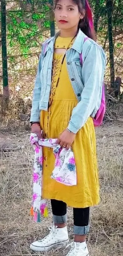 Girl in yellow dress with forest background.