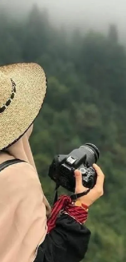 Traveler photographing lush green forest on a misty day.