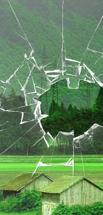 Mobile wallpaper of a landscape with cracked glass effect.