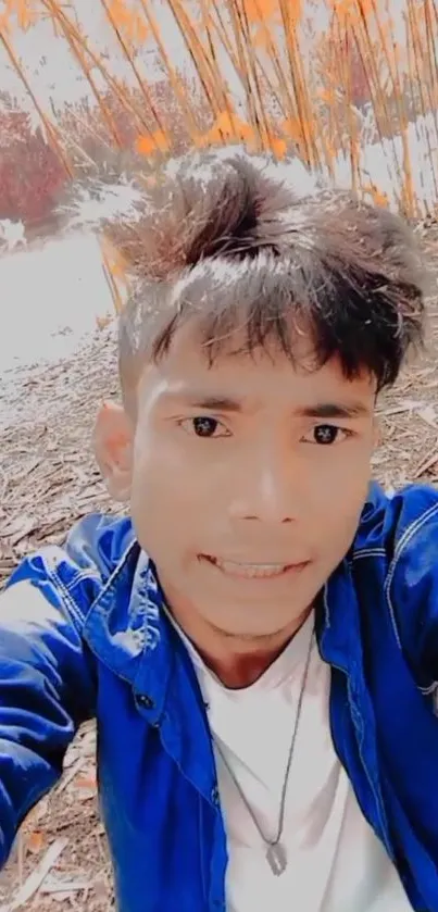 Young man taking a selfie with bamboo backdrop and vibrant colors.