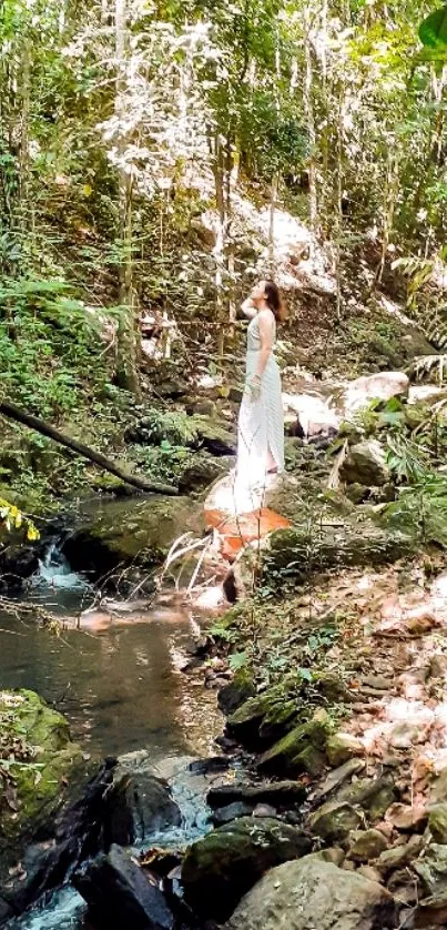 Woman standing by a forest stream in serene nature setting.