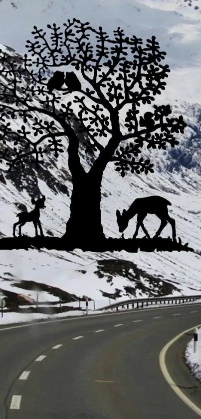 Silhouette of tree and deer on snowy mountain road.