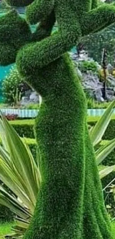 Green topiary sculpture of parent and child.