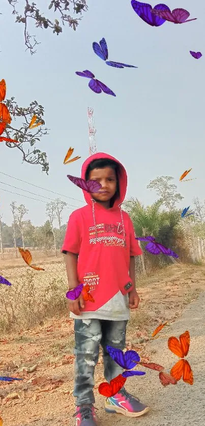 Child in red hoodie on rural path with trees and road.