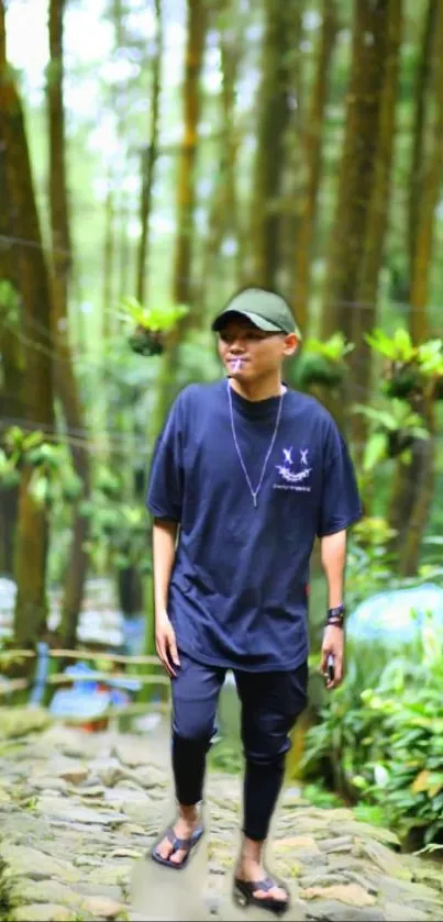 A man walks on a stone path through a lush green forest.