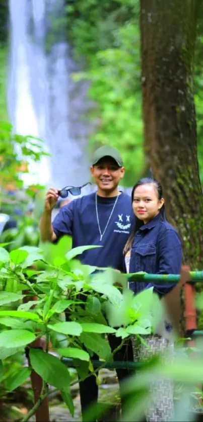 Friends enjoying a nature walk with waterfall in the background.