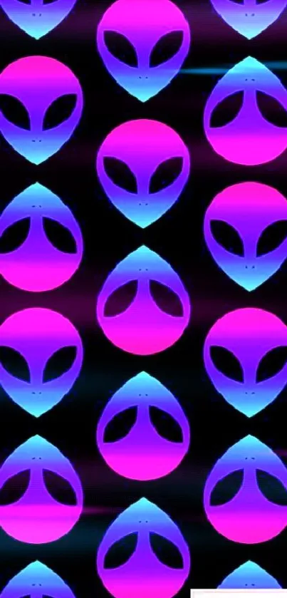 Neon pink and blue alien head pattern on black background wallpaper.