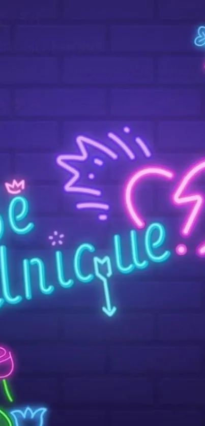 Neon 'Be Unique' text with a vibrant, colorful design on a dark background.