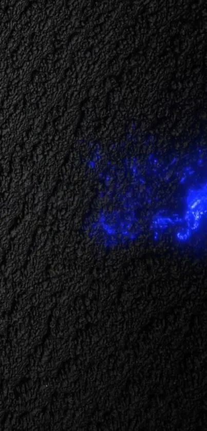 Neon blue light on dark textured background.